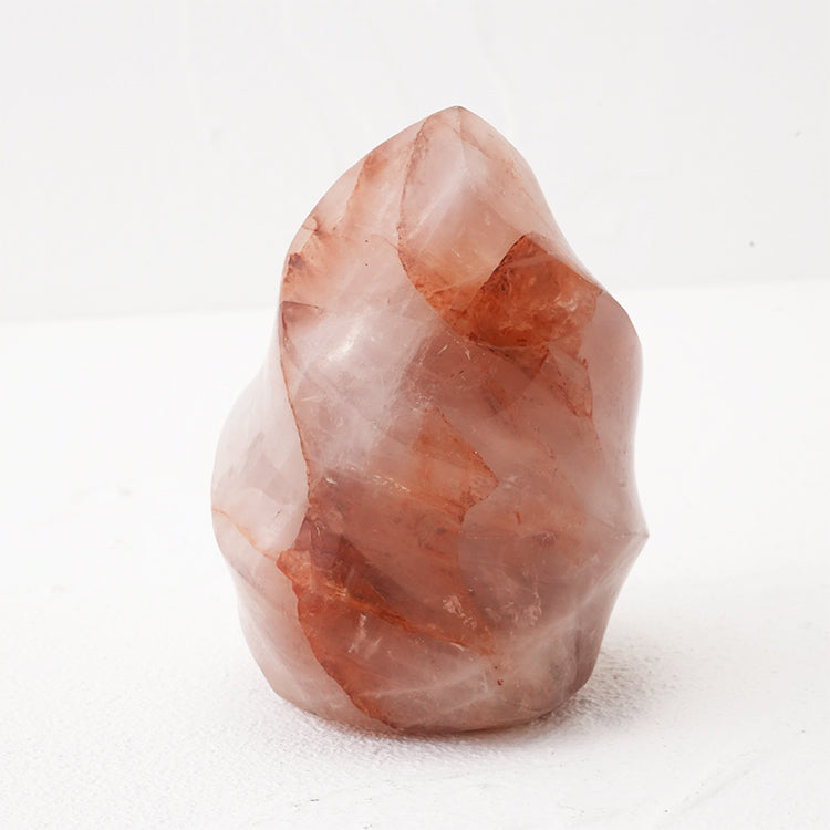 Macro photograph of red fire quartz flame highlighting its rich red color and unique flame shape.