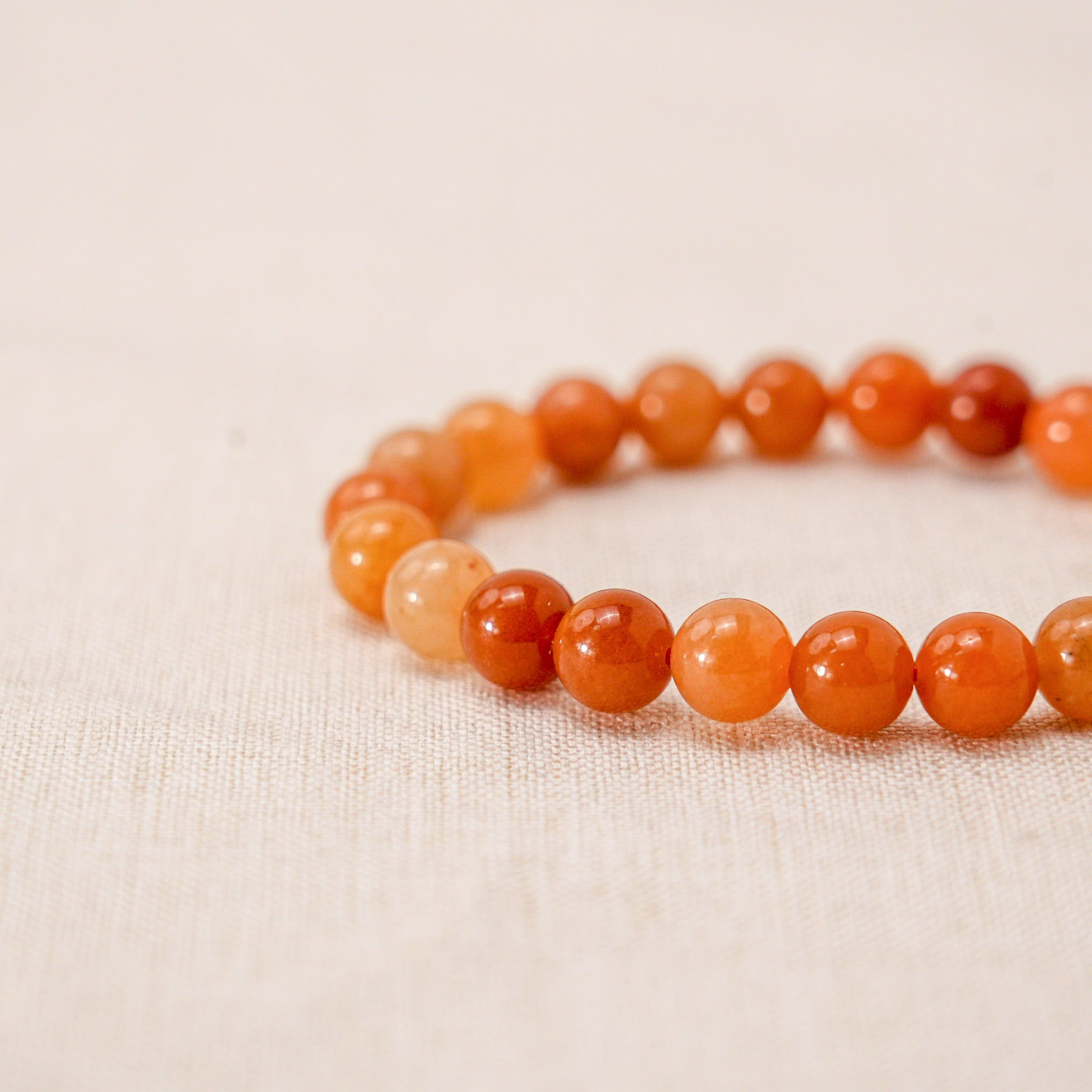 A unique Red Aventurine bracelet designed for spiritual growth and positive vibes