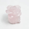 Delicate rose quartz carving of a rose in full bloom
